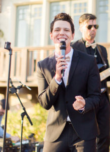Lead singer performing with a live wedding band from Ben Mallare Events & Entertainment, featuring a guitarist in the background.