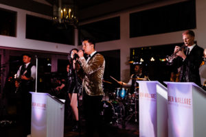 A 20-piece live wedding band from Ben Mallare Events & Entertainment performing on stage, featuring vocalists and musicians, providing entertainment at a wedding reception.