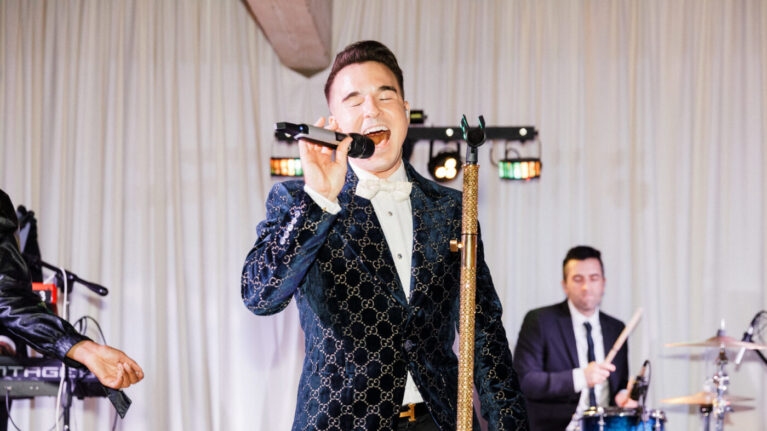Lead singer performing with Ben Mallare Events & Entertainment live wedding band, providing high-energy music for wedding receptions.