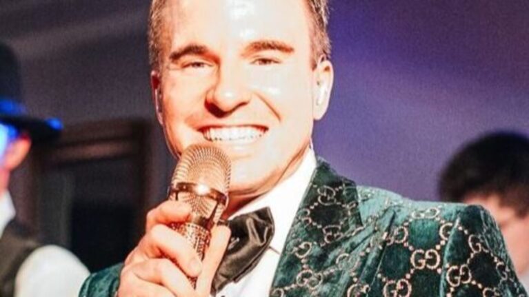 Lead singer of a live wedding band from Ben Mallare Events & Entertainment performing on stage, providing exceptional wedding entertainment.