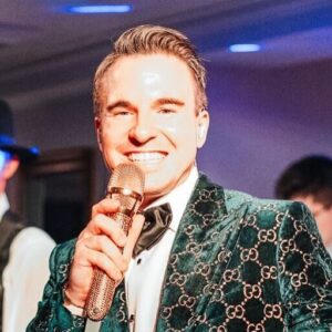 Lead singer of a live wedding band from Ben Mallare Events & Entertainment performing on stage, providing exceptional wedding entertainment.