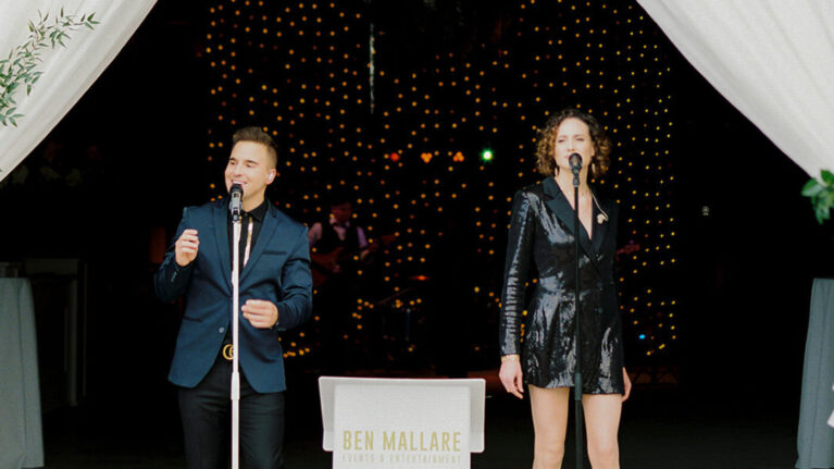 Live wedding band performance by Ben Mallare Events & Entertainment featuring two vocalists on stage, ideal for wedding receptions and live entertainment.