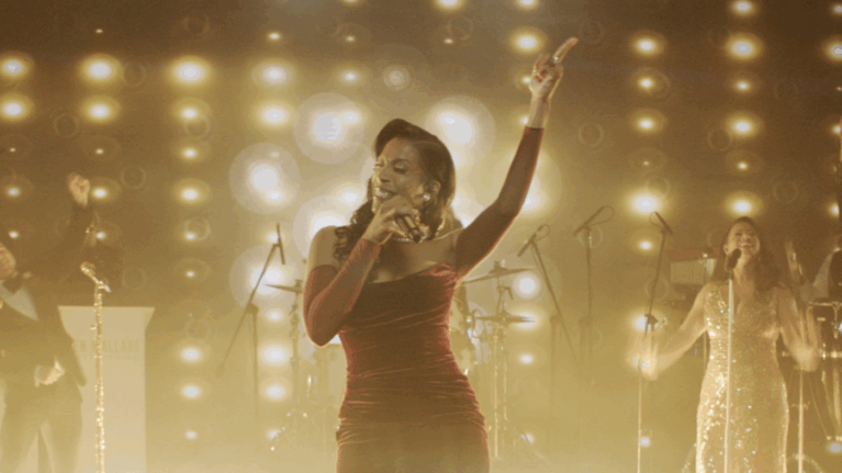 A talented singer from Ben Mallare Events & Entertainment performing on stage with a live wedding band, creating an unforgettable musical experience for wedding celebrations.