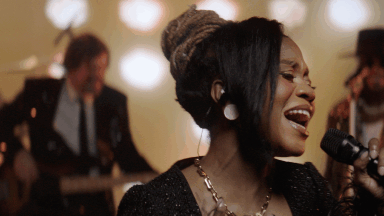 Close-up of a talented female vocalist performing with a live wedding band, part of Ben Mallare Events & Entertainment, highlighting the dynamic energy of a 20-piece wedding band.